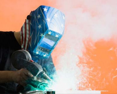 Man using a welding torch.